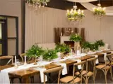 Long table setup with greenery for special event