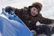 Boy tobogganing in winter