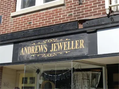 Old business sign on storefront