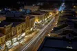 Cars passing through the downtown street at night