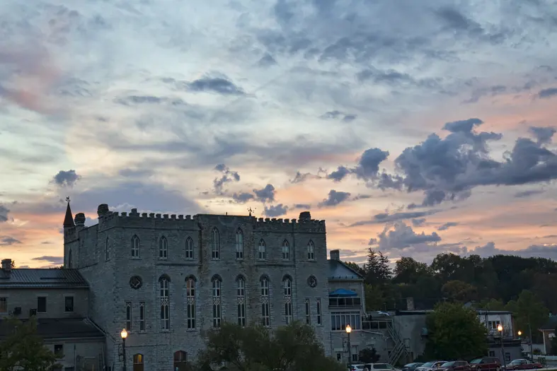 Large stone historic building with sunset sky