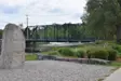 Park with green bridge in background