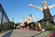 Women doing Yoga on trestle bridge
