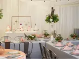 Table setup for special event with white draping background