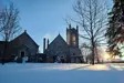 Sun shining on Church in winter