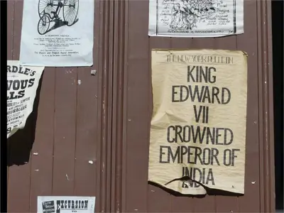 Old paper signage on wooden door