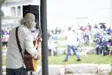 Musician playing guitar for a crowd
