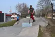 Boy riding scooter at skate park